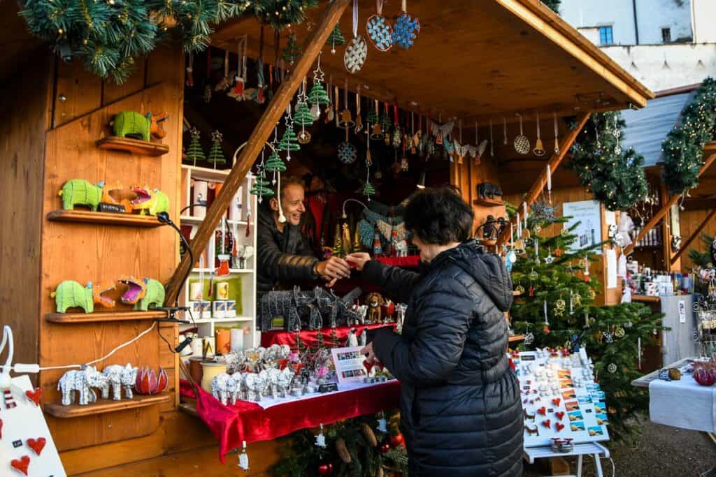My mom purchasing ornaments to take home from one of the vendors at the Salzburg Christmas market